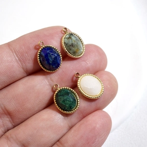 14K gold plated oval natural stone pendants for DIY jewelry making displayed on hand