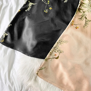 Women's floral satin nightgown in black and champagne colors with smooth silk texture