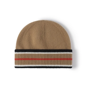 Classic striped wool knit beanie hat with camel background and soft winter texture