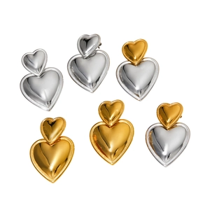 Polished double heart dangle earrings in gold and silver stainless steel finishes