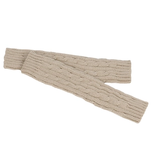 Close-up of beige cable knit arm warmers showing detailed wool texture and ribbed cuffs