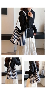 Detail view of a striped canvas tote bag showing soft texture and large capacity style