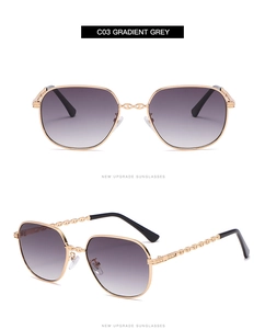 Detail view of small square sunglasses with gold metal frame and gradient grey lenses