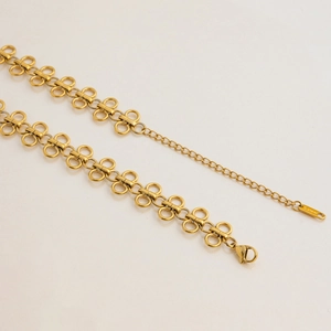 Detailed macro view of 18K gold plated stainless steel necklace with adjustable lobster clasp