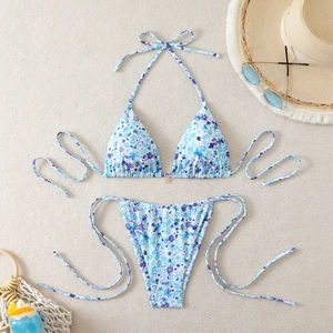 Two-piece floral high waist bikini set with bow tie and metal ring details for vacation