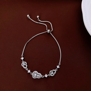 Close-up of silver adjustable chain bracelet with cubic zirconia charms and white pearls