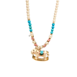 Elegant beaded pearl necklace featuring a golden rocking horse pendant with enamel details