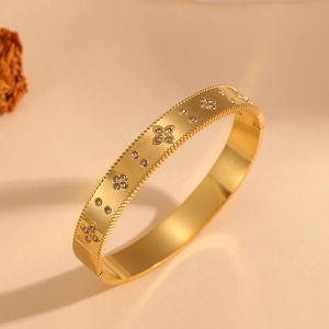 Elegant 18k gold plated stainless steel flower bangle with white crystal inlay for women