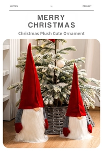 Close-up of two red and grey felt Christmas gnomes with plush beards in a cozy festive setting