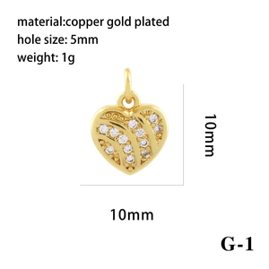 Macro view of 10mm gold plated heart pendant with zircon inlay and 5mm hole diameter