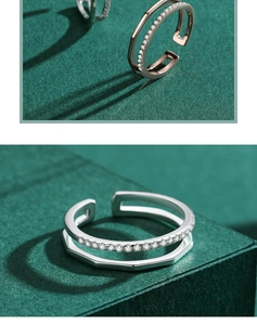 Detail of s925 silver double-layered open ring with micro-pave zircons and geometric facets