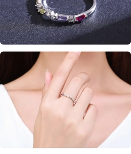 Detail of S925 silver rainbow ring with colorful rectangular crystals and model hand shot