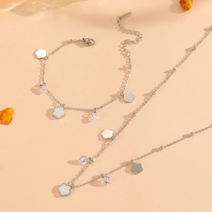 Detailed set of silver steel necklace and bracelet with white shell flower pendants