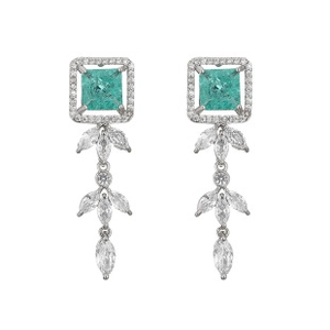 Detail of square green gem earrings with silver diamond fringe on white background