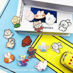 Flat lay of colorful acrylic cartoon badges with rabbit and bear motifs, 2.5-3.5cm size
