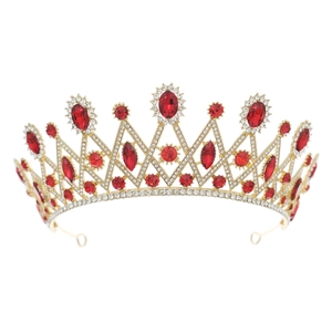 Baroque gold bridal crown with red gemstones and sparkling white rhinestones on white background
