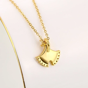 Ginkgo leaf pendant necklace in gold finish with small diamond accents on the edges