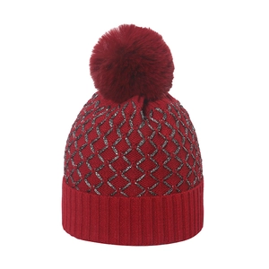 Red knit beanie with metallic silver geometric patterns and a large faux fur pompom