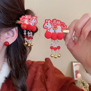 Red embroidered horse hair clip with fluffy pom poms and beaded tassel for New Year style