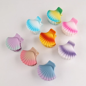 Set of minimalist colorful gradient shell hair clips in various pastel colors on white background