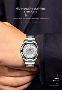 Close-up of business men automatic watch showing hollow skeleton dial and steel band