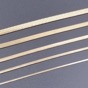 Detail view of 18k gold snake chains in five different widths from 2mm to 6mm