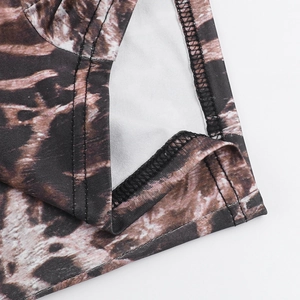 Detailed macro view of the leopard print fabric stitching and premium garment finish