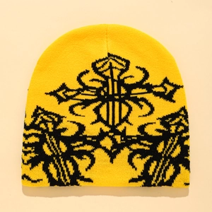Yellow knitted beanie with black gothic cross jacquard pattern in trendy hip-hop style