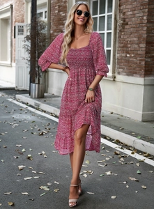 Detail of red floral dress featuring square neck, puff sleeves and high elastic waist