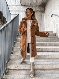 Detail of caramel teddy coat showing single-breasted buttons and plush fleece texture