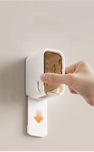 Detail of wall-mounted toothbrush holder with dustproof cover and easy mounting system