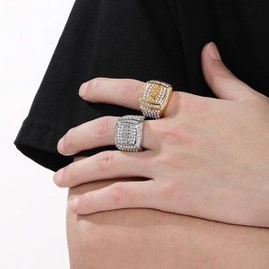 Detailed close-up of hip-hop square KING rings in gold and silver finish with rhinestones