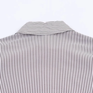 Close-up detail of the collar and back texture on a striped long-sleeved casual shirt