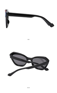 Side and back view of cat eye glasses with thick black frames and grey lenses