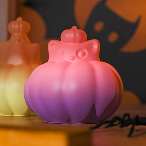 Detail of Halloween pumpkin ghost silicone molds with cute cat features and matte texture