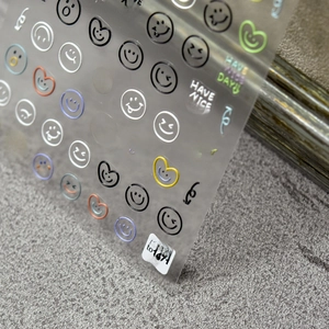 5D embossed nail stickers featuring colorful smile faces and hearts in detail