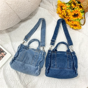 Retro washed denim tote bags in light and dark blue with adjustable shoulder straps