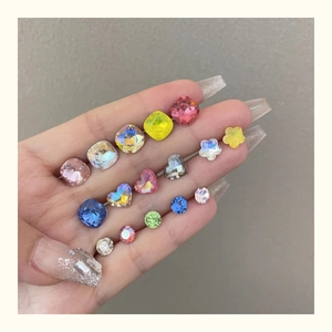 Macro view of multi-colored crystal rhinestones in star, heart, and round shapes