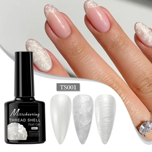 Detailed view of pearl white thread shell nail gel with 3D texture and bottle