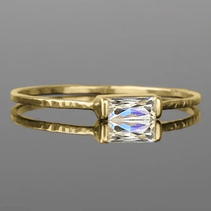Elegant gold hammered ring for women featuring a minimalist baguette-cut clear gemstone