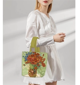 Detail of Van Gogh poppy and daisy painting print on a green leather bucket handbag