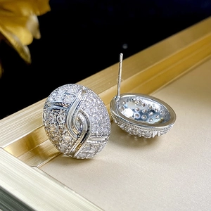 Detailed macro shot of oval zircon stud earrings with S925 sterling silver hallmarked needles