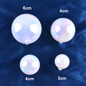 Detailed view of colorful iridescent decorative spheres in 3cm, 4cm and 6cm sizes