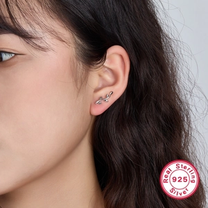 Minimalist 925 sterling silver leaf stud earrings on model for a natural elegant look