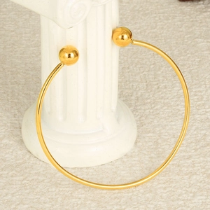 Minimalist 18K gold plated stainless steel open bangle with double bead detail