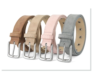 Detail of four matte PU leather belts in brown, beige, pink and gray with metal buckles