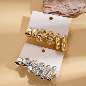 Minimalist geometric irregular pleated earrings set in polished gold and silver finish