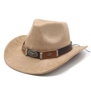 Close-up of suede cowboy hat with vintage metal bull head emblem on decorative leather band