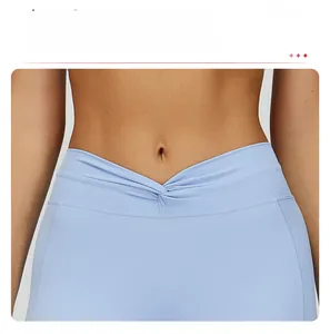 Close-up of light blue yoga pants featuring a cross-waist twisted design for slimming