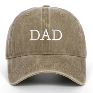 Close-up of vintage washed cotton baseball cap with white DAD embroidery in khaki